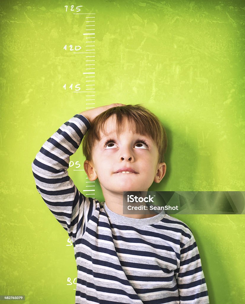 The growing child - Green Background Child Stock Photo