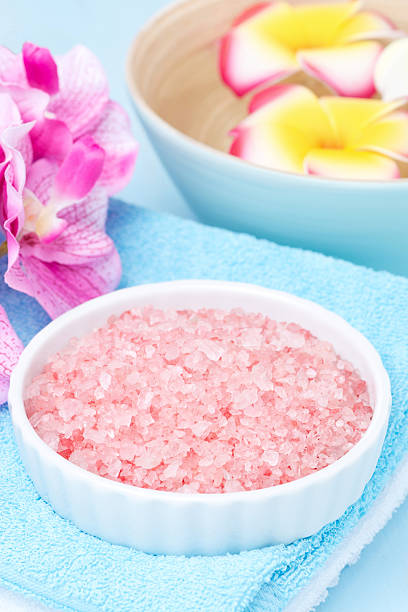 istock Spa setting with sea salt and pink flowers, vertical 482766747