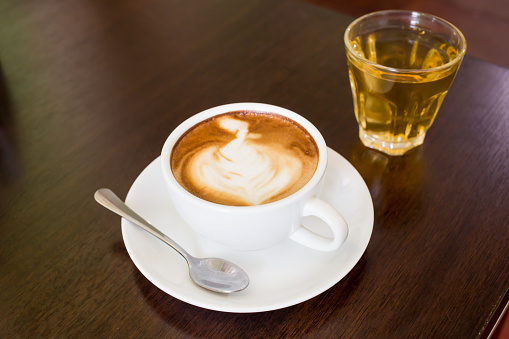 white cup of hot coffee,Coffee cup,A cup of coffee  in a white cup on wooden background