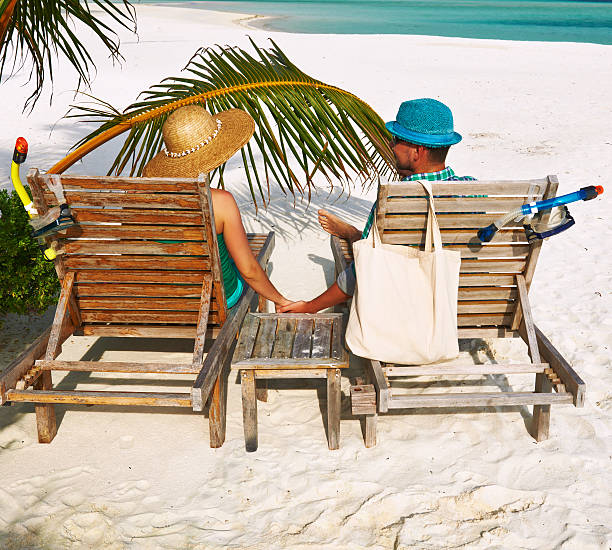 istock Couple in green on a beach at Maldives 482767863