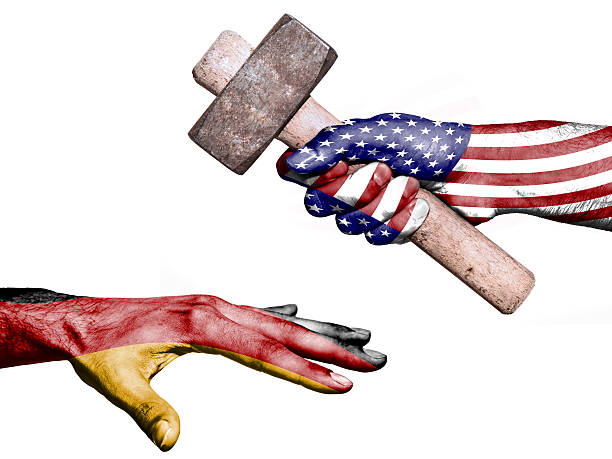 istock United States hitting Germany with a heavy hammer 482774240