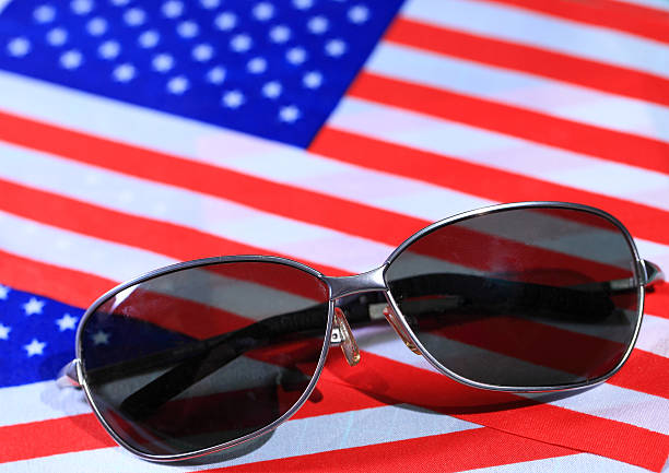 istock Sunglasses with flag america background 482778234