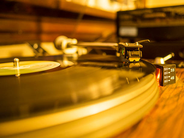 istock Vintage turntable spinning a vinyl LP record. 482778560