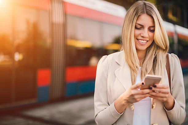 istock Young Woman Using Smart Phone on Bus Station. 482779442