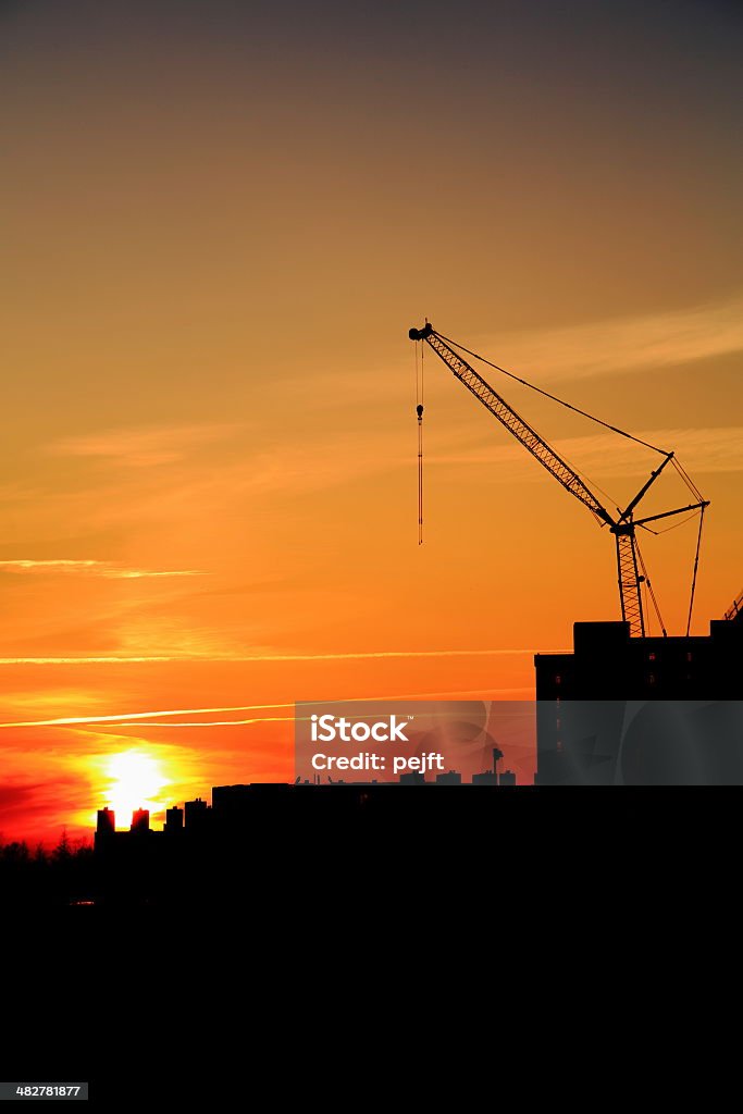 Burning morning sun constructing city skyline Back Lit Stock Photo