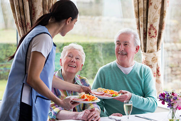 istock Senior Couple Getting Served Food 482784863
