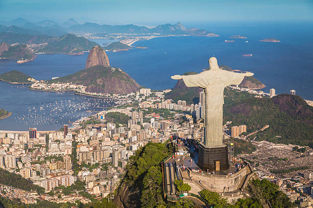 Aerial view of Christ and Botafogo Bay from high angle Rio De Janeiro, Brazil - February 11, 2015: Rio de Janeiro, Brazil : Aerial view of Christ and Botafogo Bay from high angle. Statue is located on Corcovado Hill and is facing the city and Guanabara Bay. rio de janeiro stock pictures, royalty-free photos & images