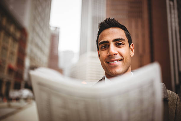 istock business man reading a newspaper on manhattan 482785343
