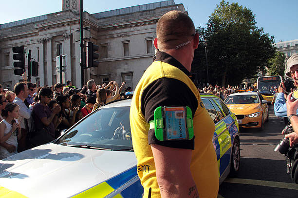 olympic torch relay in trafalgar square, london - olympic torch stock-fotos und bilder