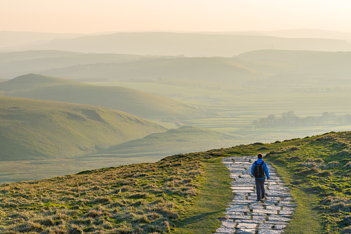 A young male walking/hiking in the Peak District National Park, England, UK.