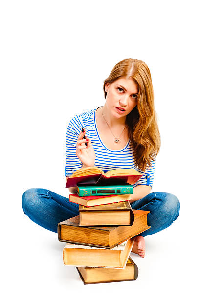 istock tortured girl with books makes lessons 482786861