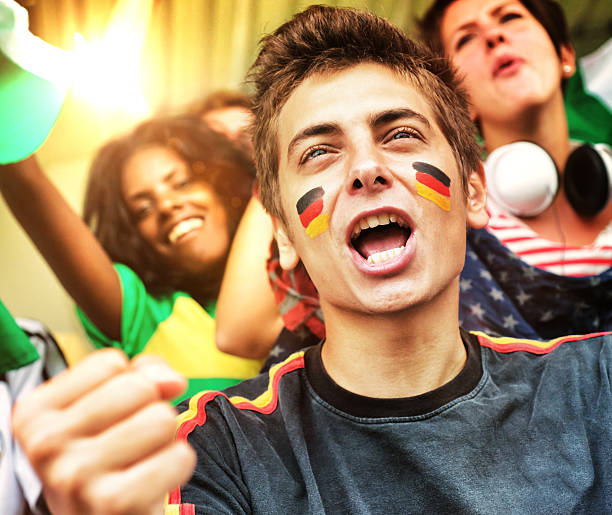 istock Supporters at Stadium. German Fan in Foreground 482786995