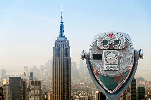 Amazing aerial view of downtown New York City with all its skyscrapers and the iconic Empire State Building.