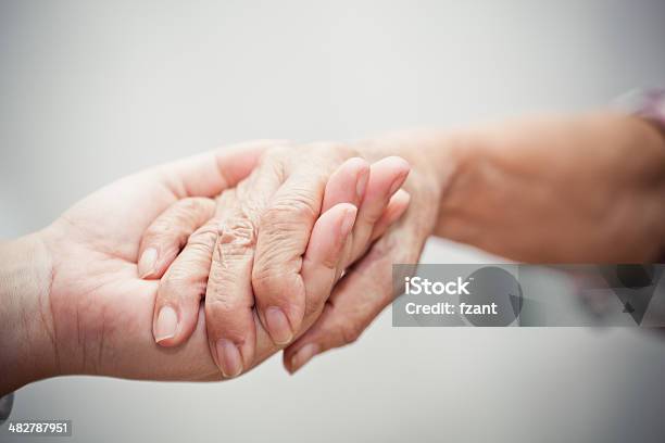 Caring Comforting Hands Stock Photo - Download Image Now - Senior Adult, Help - Single Word, 60-69 Years