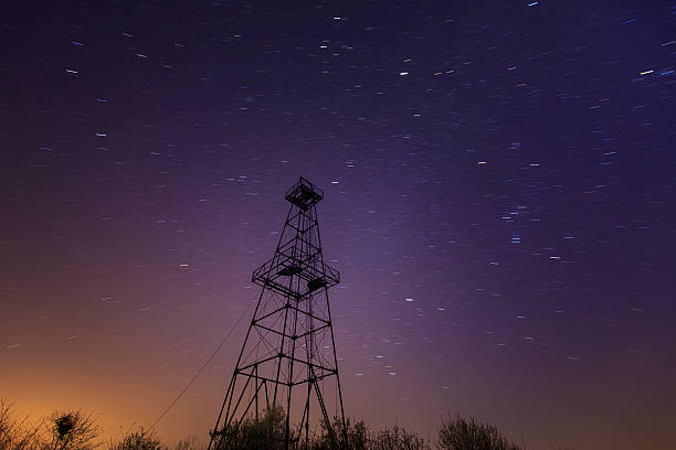 istock Oil and gas rig tower profiled on sky 482789257