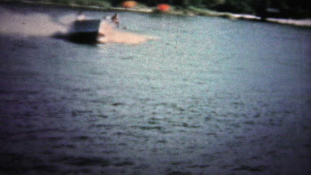 FT. LAUDERDALE, USA - 1957: Waterskiing showcase with daredevil men jumping ramps.