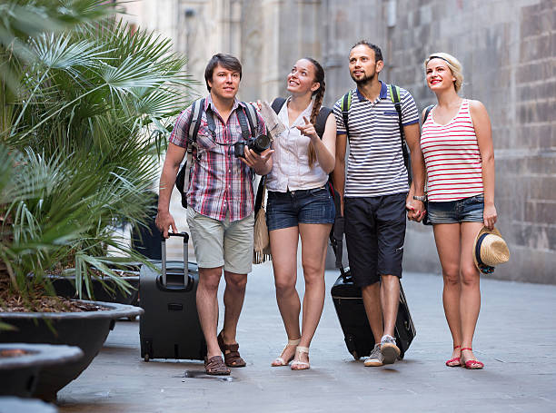 istock Couples with luggage walking the city 482794754