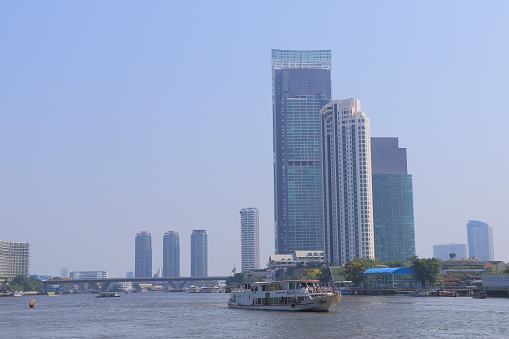 Bangkok Thailand - April 20, 2015: People travel by river boat in Chao Phraya River in Bangkok Thailand.