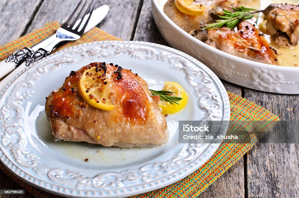 Chicken baked Chicken baked with lemon, mustard and rosemary 2015 Stock Photo