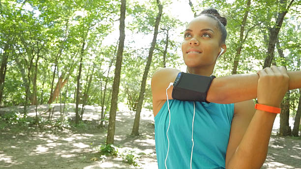istock Athletic woman warming up, stretching before running in park 482798664