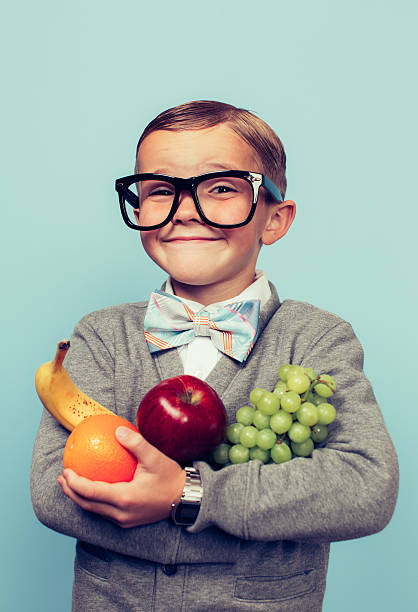 istock Young Nerd Boy Loves Eating Fruit 482798854