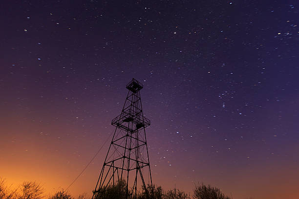 istock Oil and gas rig tower profiled on sky 482799821