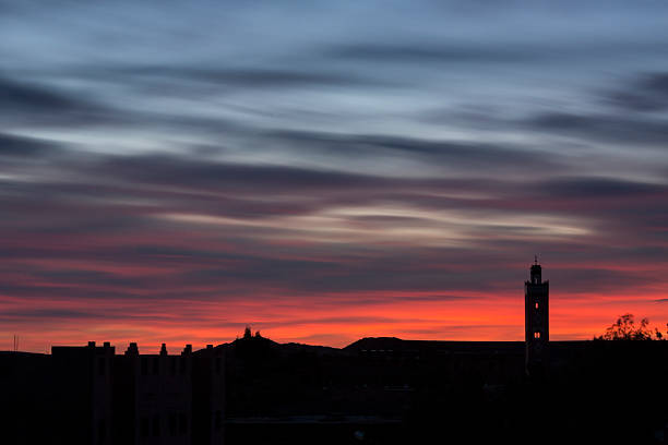 istock Traditional Mosque in Morocco sunrise with moving red clouds 482800143
