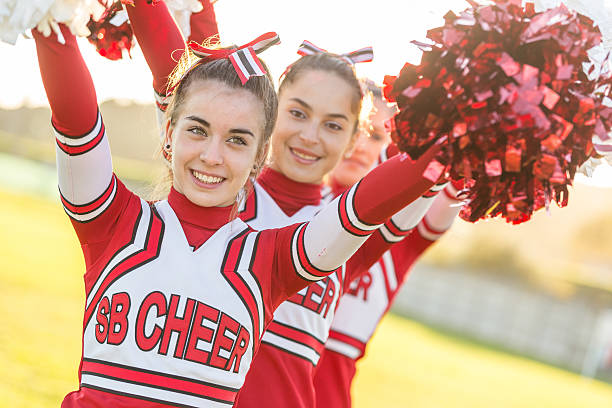 istock Group of Cheerleaders with Raised Pompom 482800761