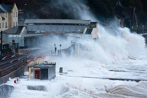 Huge waves breaking over Dawlish station in Devon stock photo