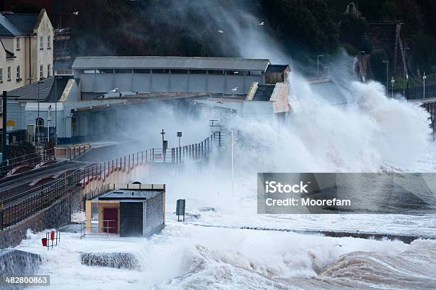 Huge Waves Breaking Over Dawlish Station In Devon Stock Photo - Download Image Now - Storm Surge, Extreme Weather, Rail Transportation