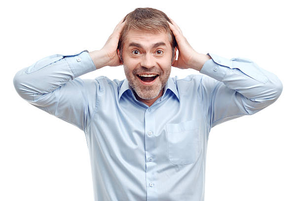 istock Smiling male holding his head 482803142