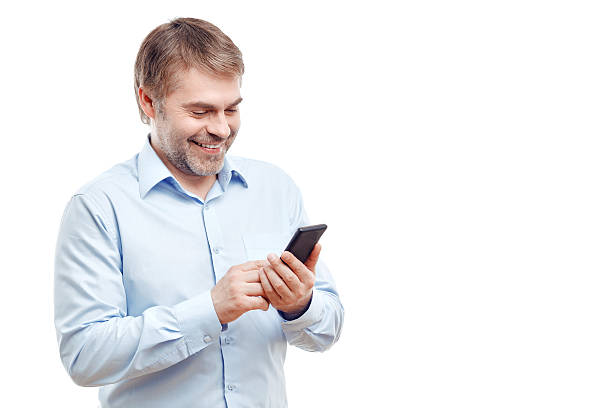 istock Vivacious man holding mobile phone 482803186
