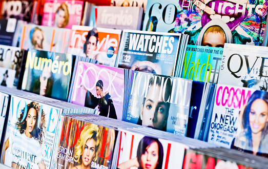Los Angeles, USA -  May 15, 2013: American Magazines displayed for sale on newsstand in Los Angeles, USA