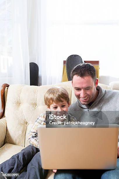 Father And Son On Laptop Stock Photo - Download Image Now - Adult, Boys, Child