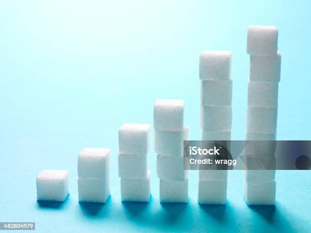 Sugar Cubes Bar Chart On A Blue Background Stock Photo - Download Image Now - Sugar - Food, Tower, Cube Shape