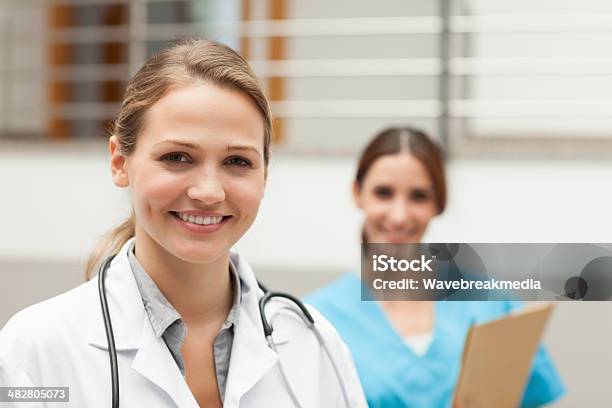 Doctor And Nurse Standing Stock Photo - Download Image Now - Horizontal, No People, Photography