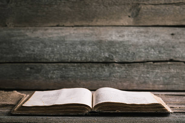 istock An old book on an old wooden background 482805750