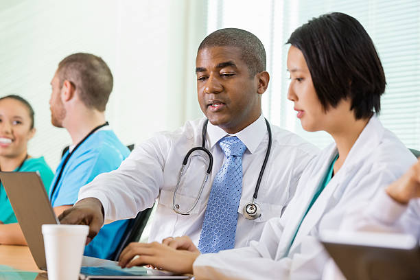 istock Hospital doctors working together on laptop during meeting 482805973