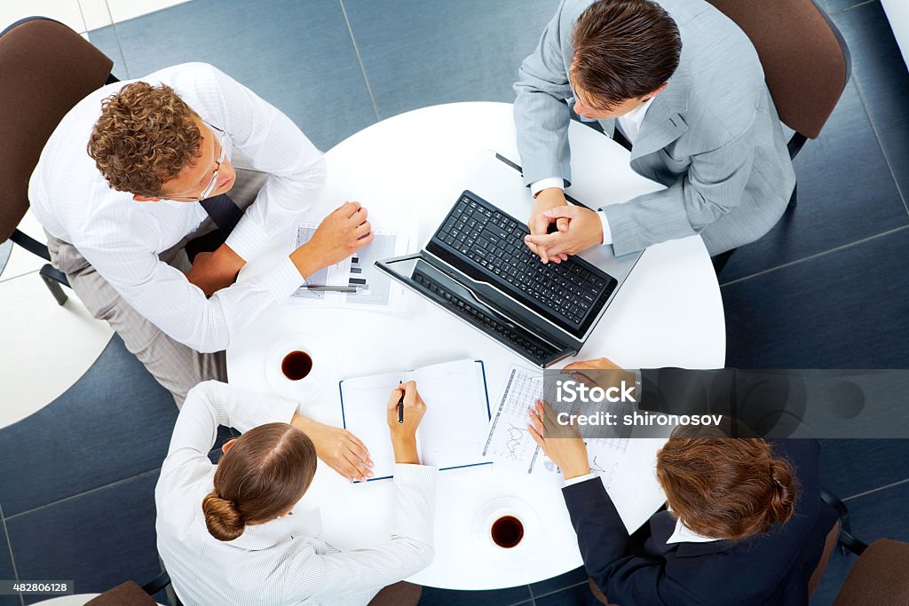 Working people Above view of several business people planning work at round table 2015 Stock Photo