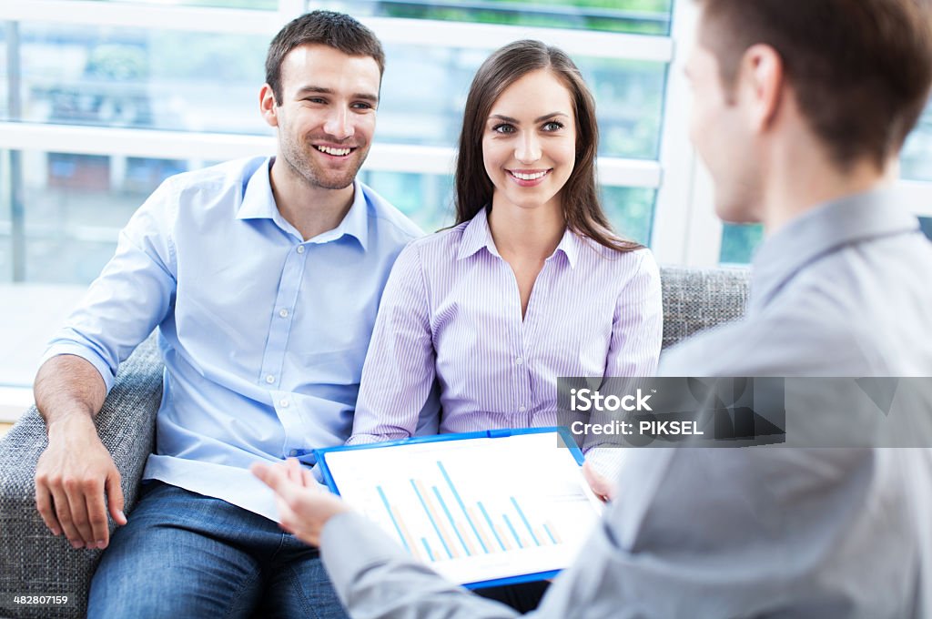 Couple meeting with financial adviser Adult Stock Photo