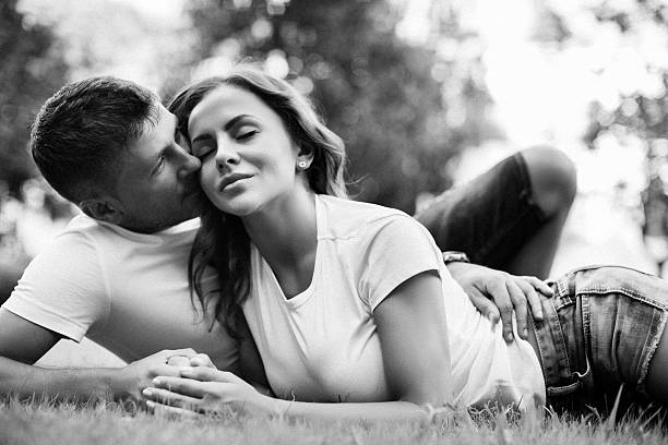 istock Man and woman lie on the lawn 482809194