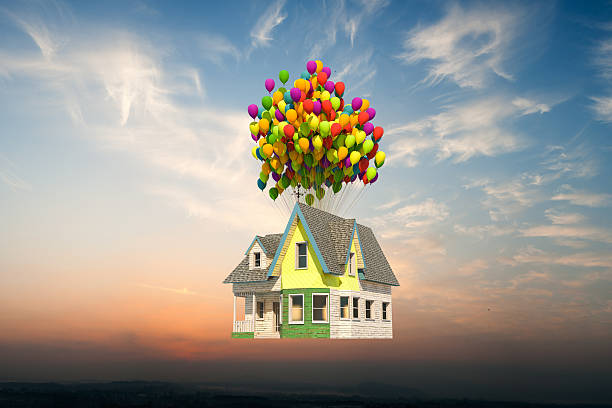istock wooden victorian house flying up 482809888