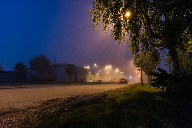 Fog at night road, city landscape stock photo