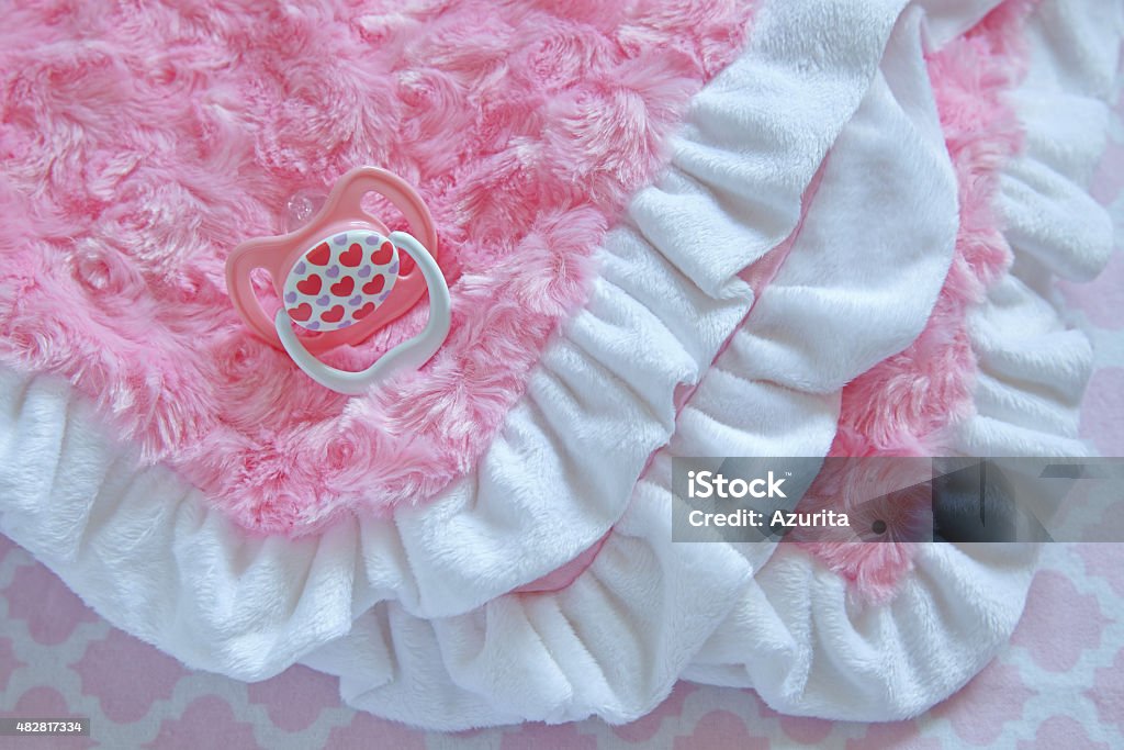 Layette for newborn baby girl Pink layette for a newborn baby girl 2015 Stock Photo