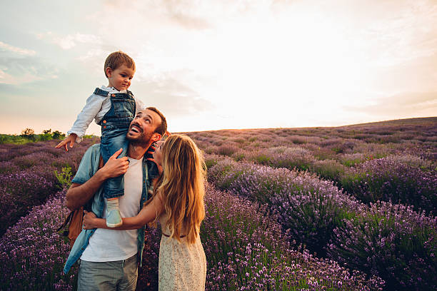 Happy times Photo of happy little family enjoying together at the lavender field lavender plant photos stock pictures, royalty-free photos & images