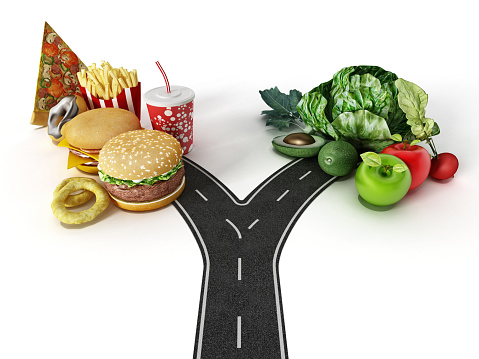 Road with a choice between fast food and healthy food.