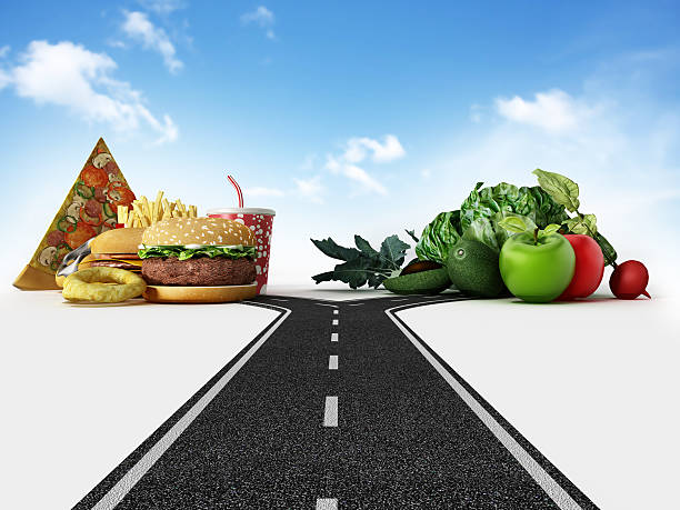 istock Choice between fast food and healthy food 482817582
