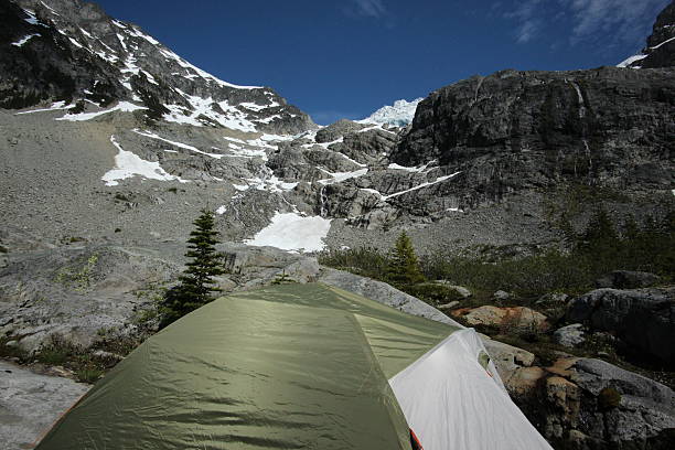 istock Sleeping in a tent at a base of a mountain 482818138