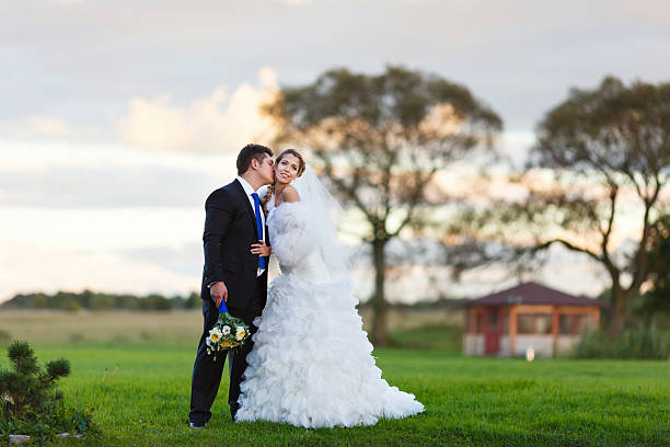 istock Bride and groom walking on the field 482820100