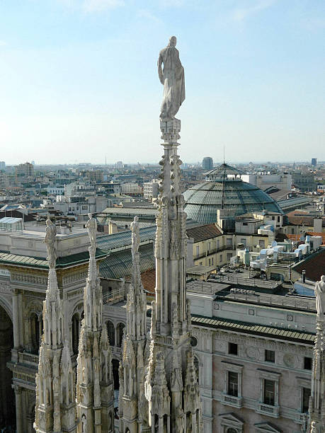 istock Closeup of Milan Duomo spire with statue on top. 482820124